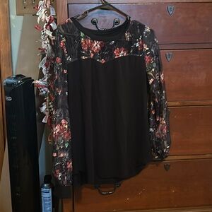 A cute Black top with laced flowers up/down the arms